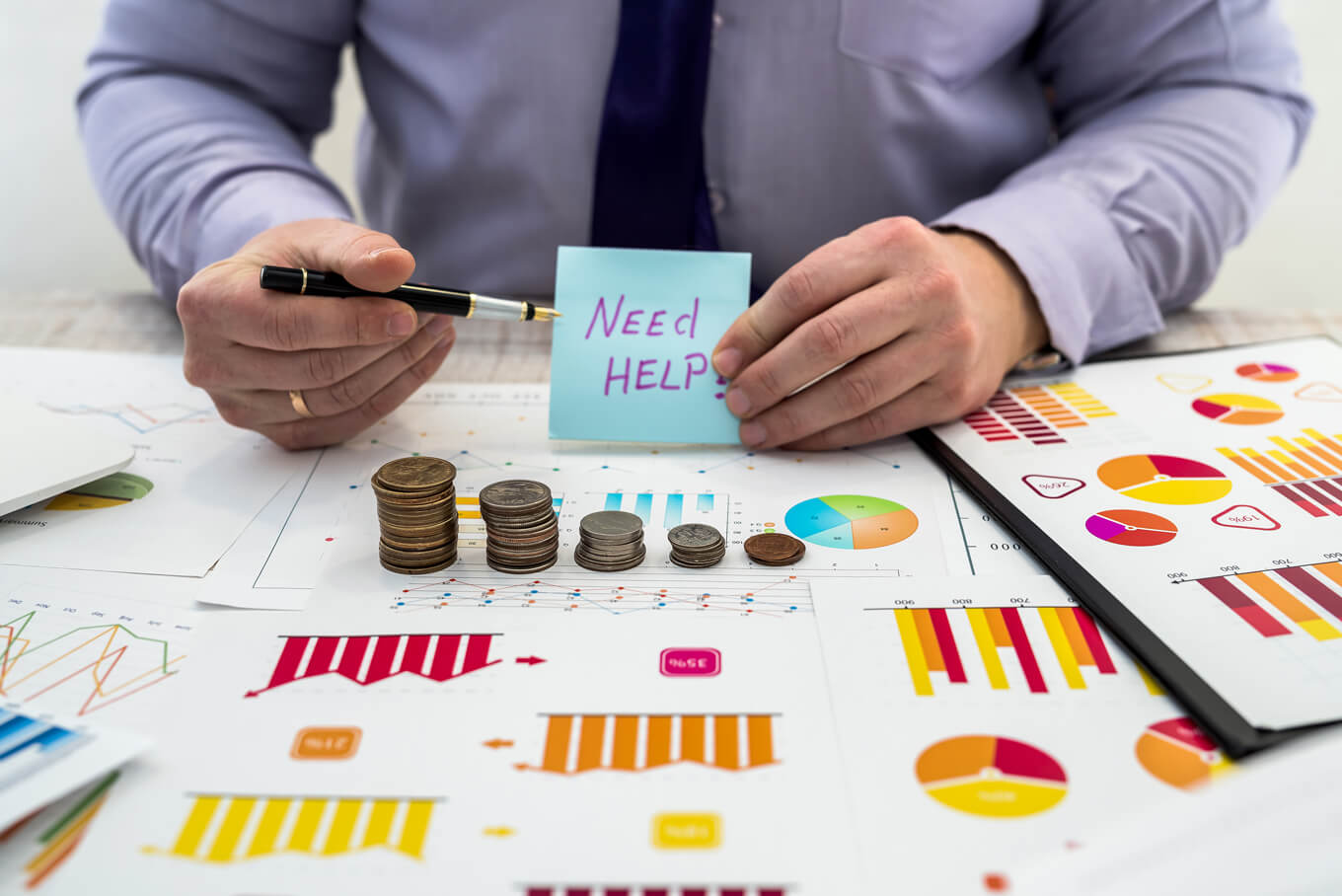 Businessman working analyzing company profits using charts documents using coins business analysis strategy concept | interpreters